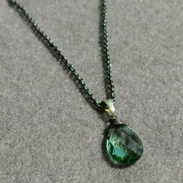 Groene amethist in goud en zilver